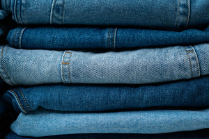 Stack of denim jeans